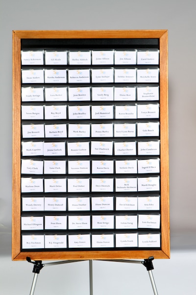 product name tag tamer oak frame display board full of name badges